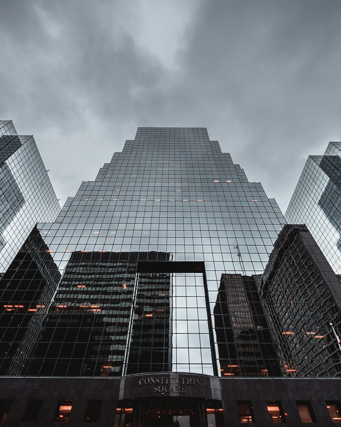Glass office towers seen from street level